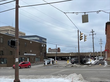Parking entrance and building exterior positioned on the left