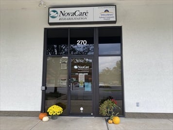 Glass paned entry door to phsyical therapy center.