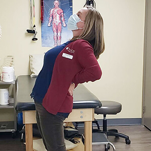 woman demonstrating lumbar extension stretch