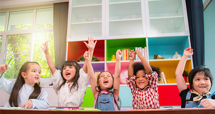 Specialized pediatric services - children laughing and raising hands